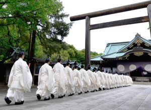 Monks in white at shrine - Japan.jpg